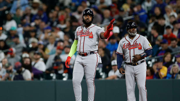 Aug 28, 2023; Denver, Colorado, USA; Atlanta Braves designated hitter Marcell Ozuna (20) gestures after hitting an RBI single in the seventh inning against the Colorado Rockies at Coors Field.